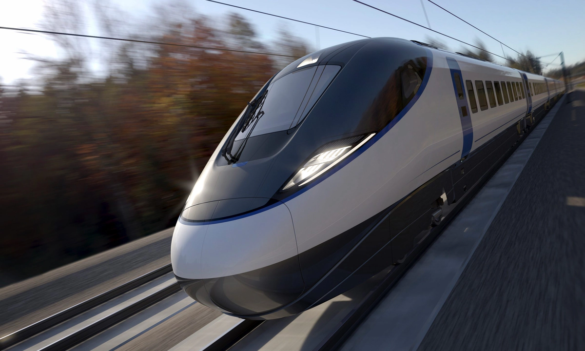 A commercial passenger train in motion on a train track.