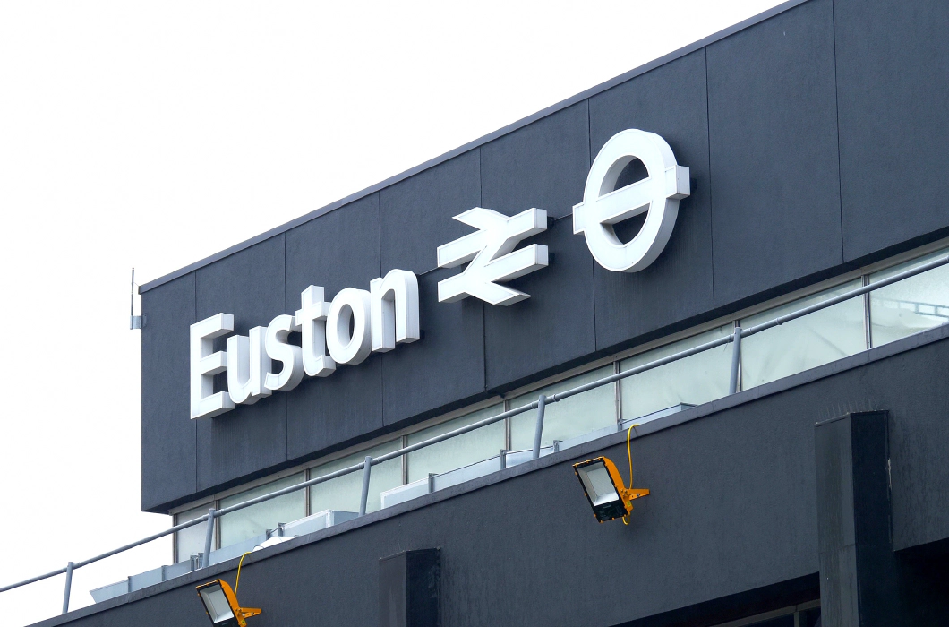 A white sign on a black background reading Euston from the Euston train station.