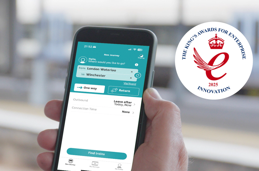 On the left, a teal background with Transreport logo in white and the King’s Awards for Enterprise 2025 Innovation emblem are displayed. On the right, a person uses the Passenger Assistance app on a smartphone to plan a train journey from London Waterloo to Winchester.