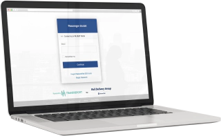 A laptop computer showing the Passenger Assistance Staff Web Platform login page.