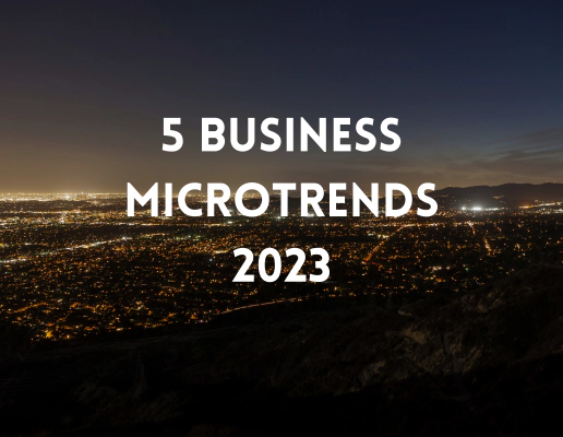 A city skyline at night, with the text '5 Business Microtrends 2023' overlayed.