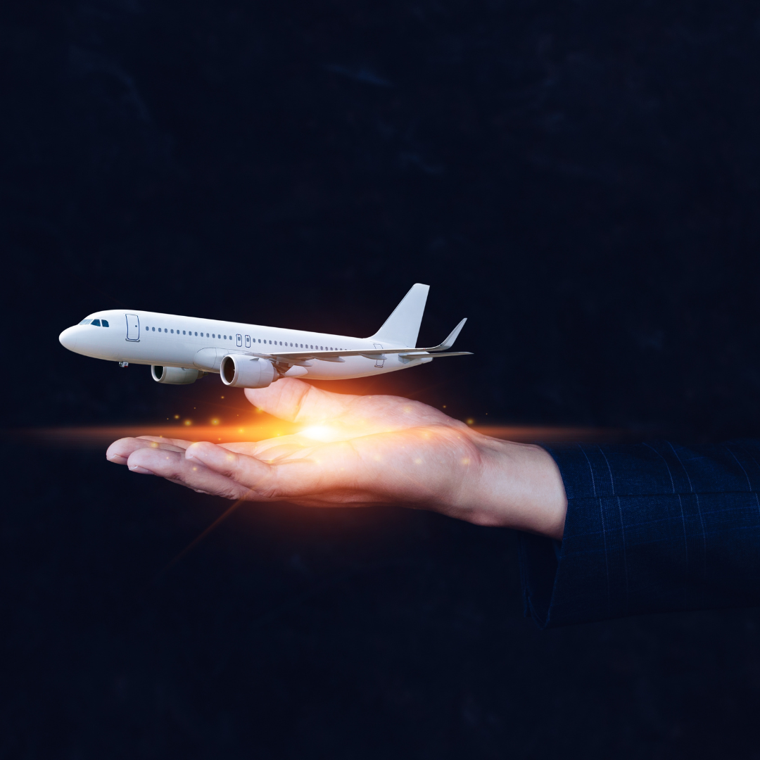 Photo of a hand outstretched horiontally to the centre of the image, with a graphic of a white plane in flight above this, with gold light in the palm. Black background.